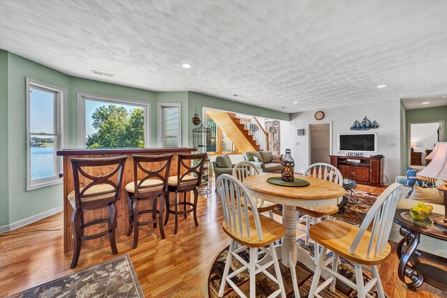 900 Lakemount Dr, Moneta, VA 24121 - dining space with stairs, light wood-style floors, baseboards, and recessed lighting