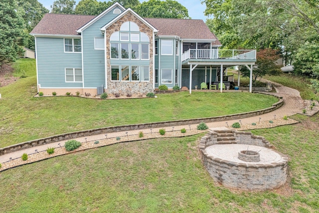 900 Lakemount Dr, Moneta, VA 24121 - rear view of property with an outdoor fire pit, a wooden deck, a lawn, a patio area, and roof with shingles