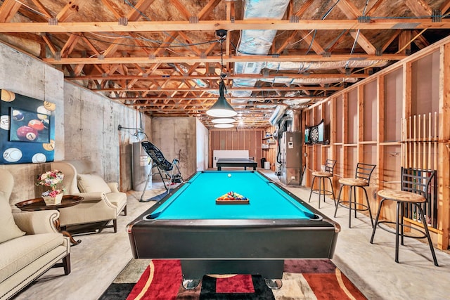 game room with billiards, heating unit, and concrete flooring