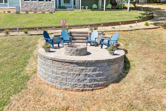 exterior details with an outdoor fire pit