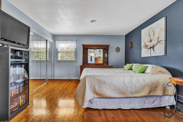 bedroom with light hardwood / wood-style flooring