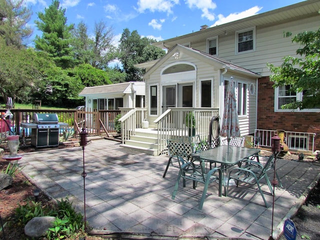 view of patio / terrace featuring area for grilling and a wooden deck