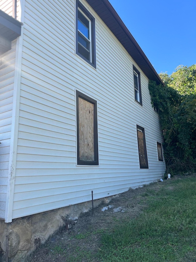 view of home's exterior featuring a lawn