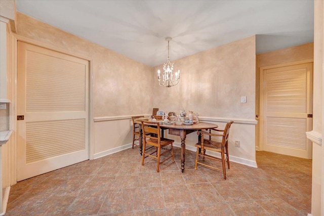 dining area featuring a chandelier