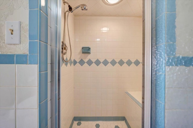 bathroom featuring an enclosed shower