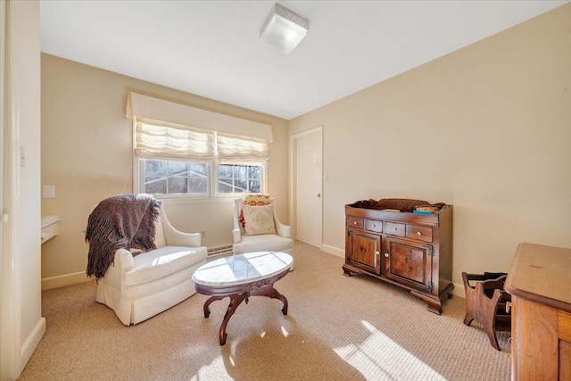 sitting room featuring light carpet