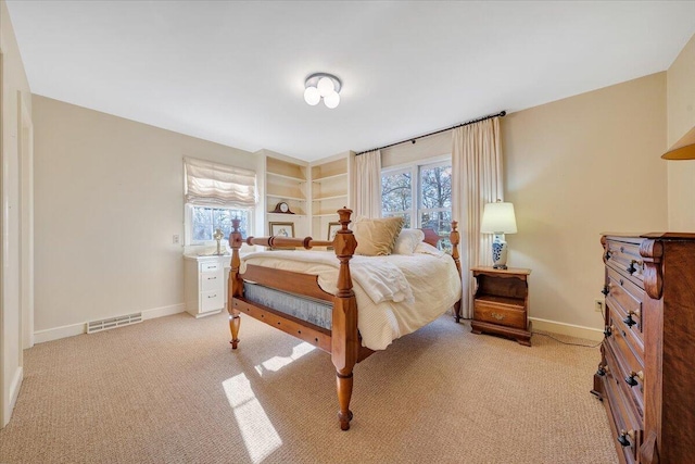 bedroom with light carpet