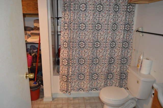 bathroom with shower / bath combination with curtain and toilet