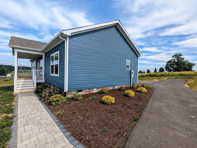 view of home's exterior featuring a porch