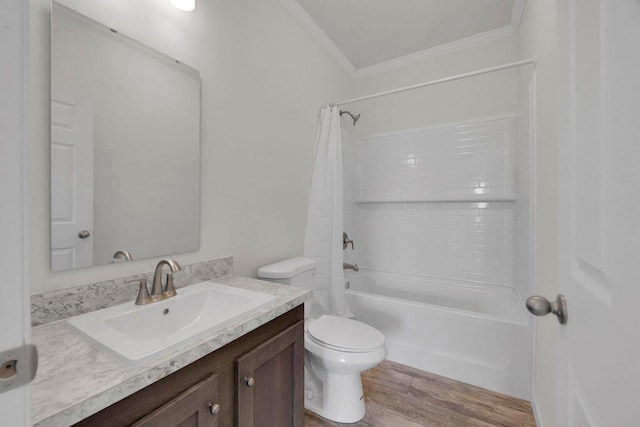 full bathroom featuring hardwood / wood-style flooring, crown molding, toilet, shower / bath combo with shower curtain, and vanity