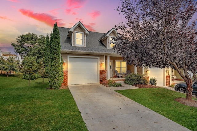 view of front facade featuring a lawn and a garage