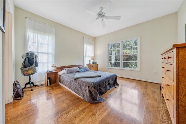 bedroom featuring light wood-type flooring and ceiling fan