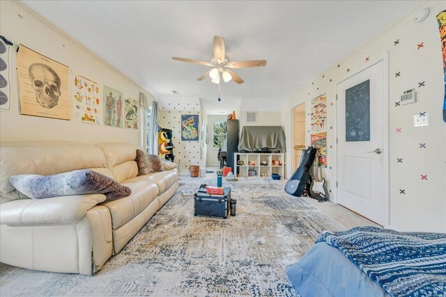 carpeted living room with ceiling fan