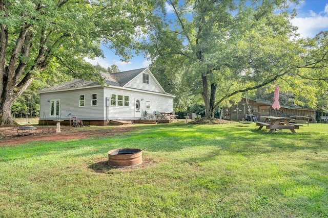 view of yard with a fire pit