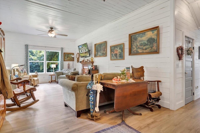 living room with ceiling fan, wood ceiling, and light hardwood / wood-style floors