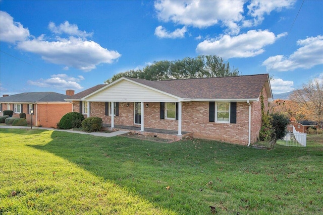 ranch-style house featuring a front lawn