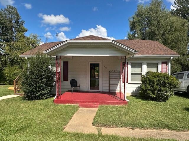 view of front facade with a porch and a front yard