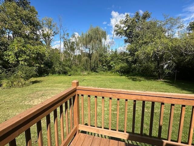 deck featuring a lawn