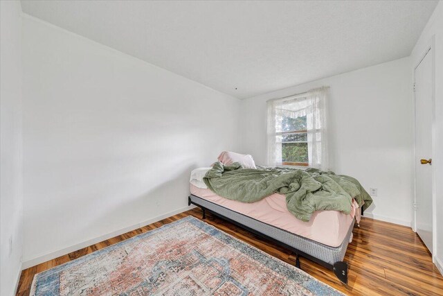 bedroom featuring wood-type flooring