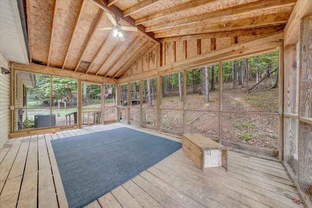 unfurnished sunroom with vaulted ceiling and ceiling fan