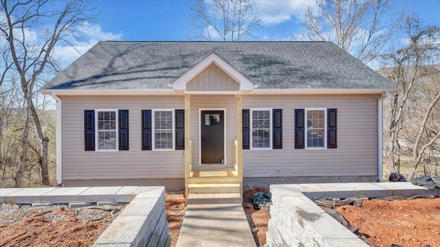 view of front of house with a shingled roof