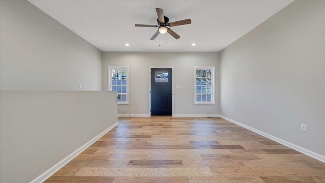 foyer entrance with light wood-style floors, recessed lighting, ceiling fan, and baseboards