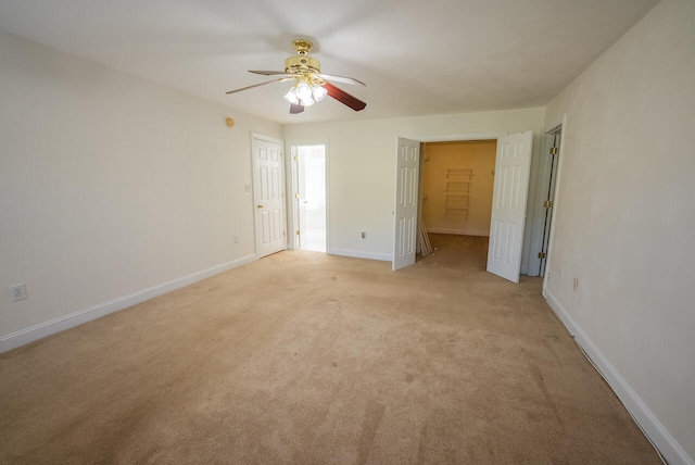 interior space featuring ceiling fan and light carpet