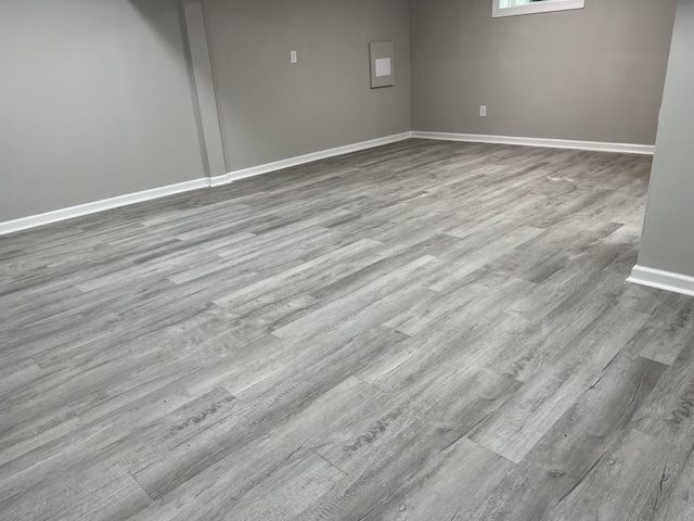 spare room featuring light hardwood / wood-style floors