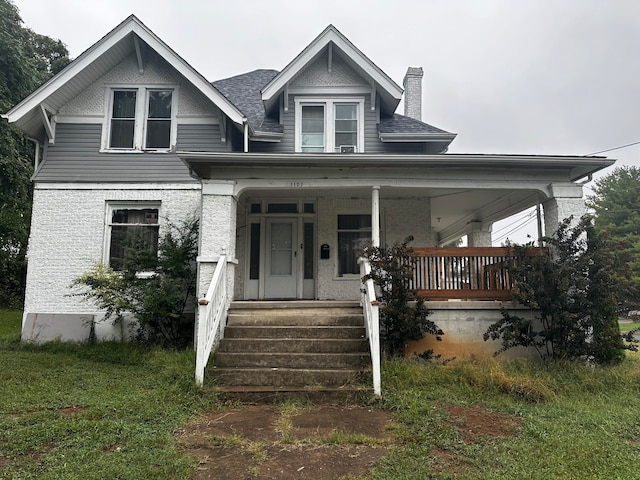 view of front of property featuring covered porch