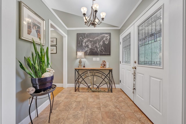 tiled entryway with a notable chandelier, vaulted ceiling, and crown molding