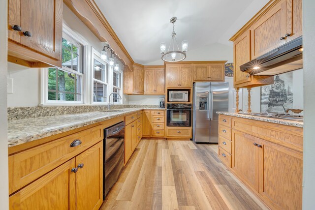 kitchen featuring vaulted ceiling, light stone counters, black appliances, light hardwood / wood-style flooring, and a notable chandelier