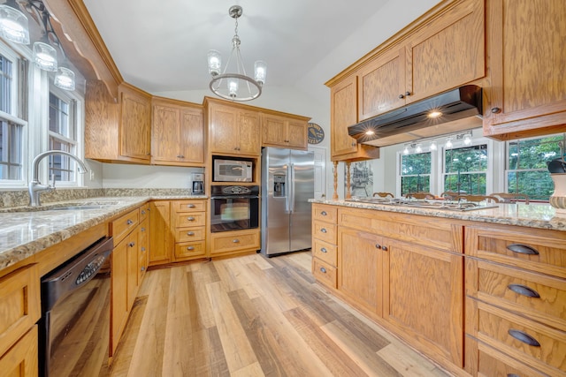 kitchen featuring light stone countertops, light wood-type flooring, black appliances, lofted ceiling, and a chandelier