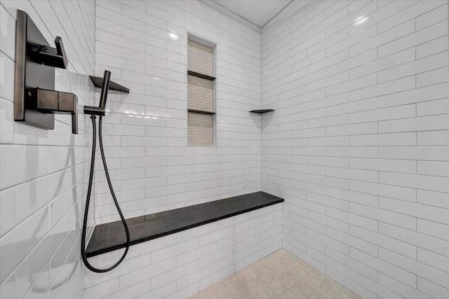 bathroom featuring tiled shower