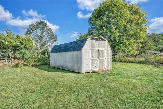 view of outbuilding with a lawn