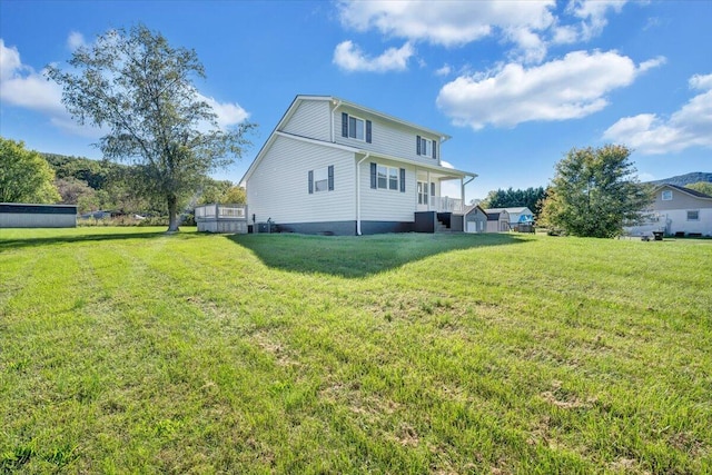 rear view of property with a yard