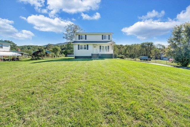 back of property featuring a lawn