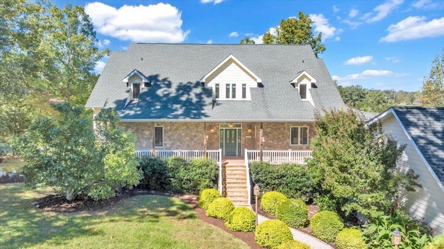 new england style home with a front yard