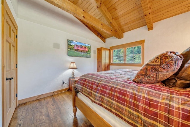 bedroom with vaulted ceiling with beams, wood ceiling, and hardwood / wood-style floors