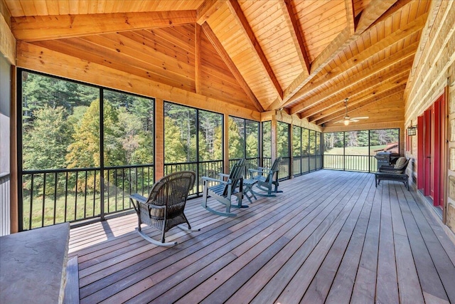 unfurnished sunroom with lofted ceiling with beams and wooden ceiling