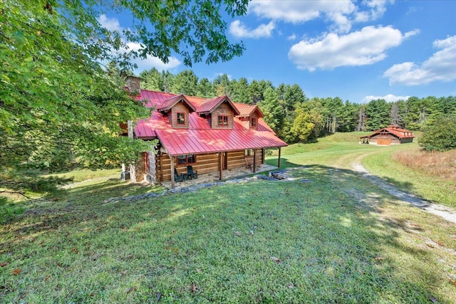 exterior space featuring a front lawn