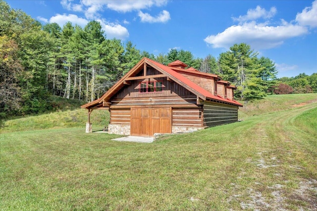 view of outbuilding with a lawn