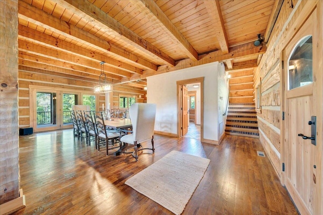 dining space with wood-type flooring, wood ceiling, and beamed ceiling