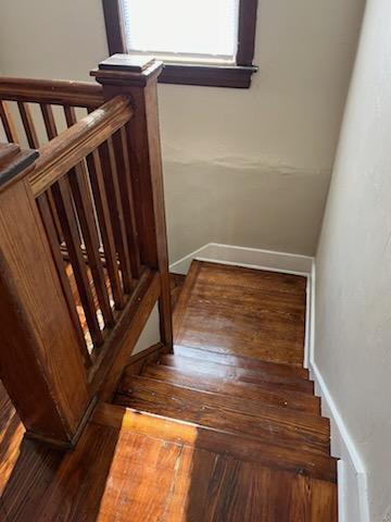 stairway with wood-type flooring