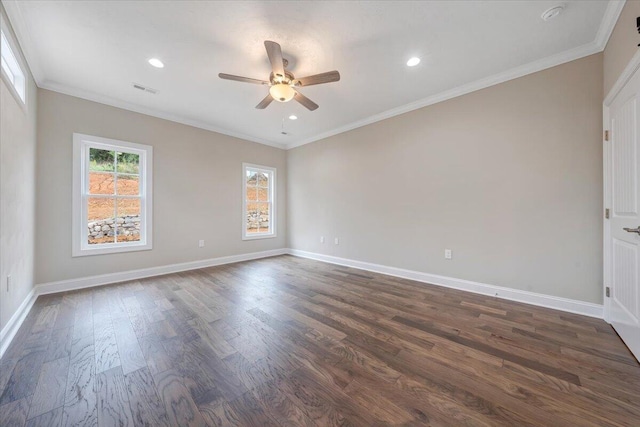 empty room featuring ornamental molding, ceiling fan, and dark wood-type flooring