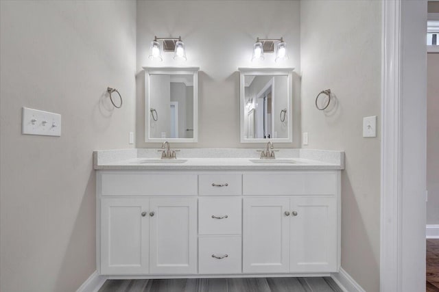 bathroom featuring vanity and wood-type flooring