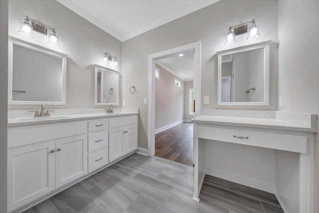 bathroom featuring vanity, hardwood / wood-style flooring, and ornamental molding