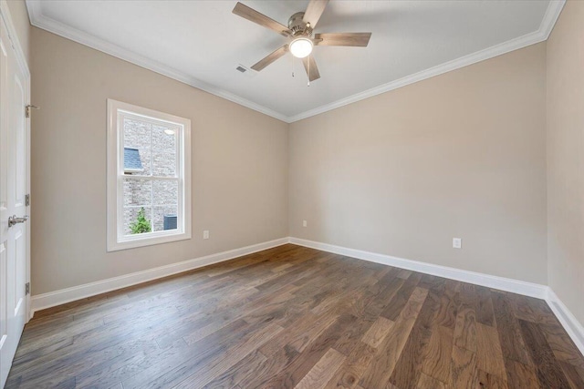 spare room featuring ceiling fan, dark hardwood / wood-style flooring, and crown molding