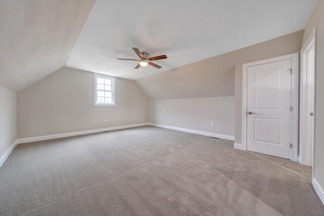 bonus room featuring carpet floors, vaulted ceiling, and ceiling fan