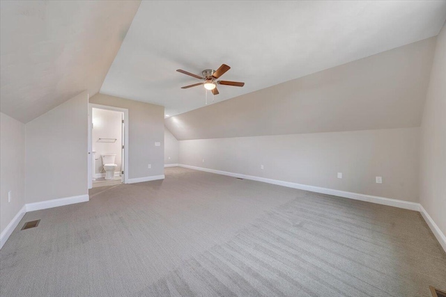 additional living space with carpet, ceiling fan, and lofted ceiling