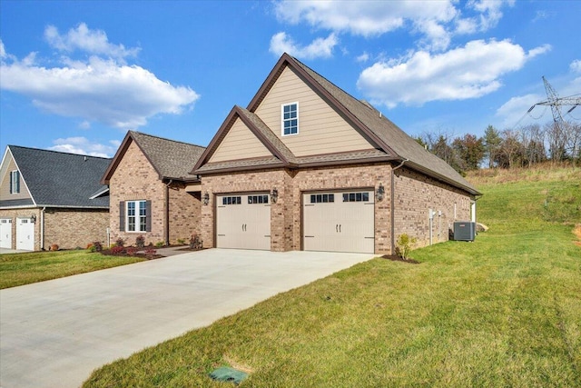 craftsman-style home featuring a front yard and central AC